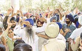 Riot victims protest after they were not allowed to enter the venue for a meeting of a high-level committee at the mini-secretariat in Ludhiana on Saturday. 