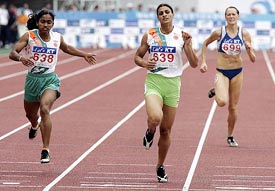 Manjit Kaur  crosses the finish line ahead of Satti Geetha to win the womens 400 metres final at the Asian Athletics Championships in Incheon, South Korea
