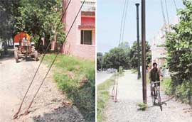 An electricity pole and wires hinder the smooth flow of traffic on a cycle track in Sector 34