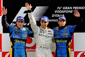 Renault driver Fernando Alonso of Spain, McLaren driver Juan Pablo Montoya of Colombia and Renault driver Giancarlo Fisichella of Italy pose for photographers at Monza race track in northern Italy Sunday