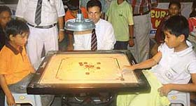 Players concentrate on their moves in the 33rd Sub-Junior National and Inter-State Carrom Championship being organised in Chandigarh