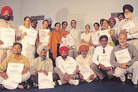Teachers of various government schools of Punjab who were given state award by Education Minister, Harnam Dass Johar on Teachers Day at PSEB auditorium