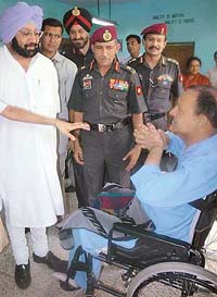 Punjab Chief Minister, Capt Amarinder Singh, interacts with an inmate of the Paraplegic Rehabilitation Centre during his visit to the centre in Mohali