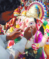 An artist works on an idol of Lord Ganesha in the Capital. Idols of the god will be immersed in the the Yamuna as part of a ritual on the last day of the 10-day festival which begins on Wednesday. 