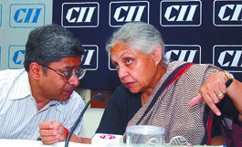 Chief Minister Sheila Dikshit having a word with Delhi Jal Board CEO Rakesh Mohan during a seminar on Efficient usage of water through water saving devices at the CII headquarters in the Capital on Tuesday.