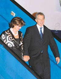 British Prime Minister Tony Blair and his wife, Cherie, arrive in New Delhi on Tuesday. 
