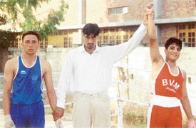 Refree Harpal Singh, an international boxer, raises the hand of Shri Ram Sikka of BVM School Kitchlu Nagar, Ludhiana, who won a gold in the Ludhiana District Inter-School Boxing Championship held