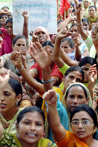 Anganwadi workers from Punjab under the banner of the Anganwadi Workers Helpers Union hold a demonstration demanding wage revision and other incentives from the Punjab Government in New Delhi on Tuesday. 