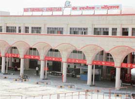 All dressed up and no where to go: The bus stand silently awaits its inauguration even as travellers are put to inconvenience.