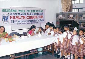 Doctors examine children at a medical camp in Shishu Niketan Model Senior Secondary School, Chandigarh