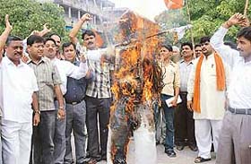 Activists of the Bharatiya Janta Yuva Morcha burn an effigy of the Central Government against hike in petrol and diesel prices in Chandigarh