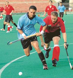 Deepak Thakur of Chandigarh XI makes his move in an exhibition match with British Army Hockey at Hockey Stadium, Sector 42, Chandigarh