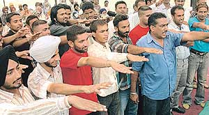Youths from several villages in the Khizrabad-Kurali-Anandpur Sahib belt take an oath in Kubaheri village to join public action in their area against the use of drugs on Tuesday.