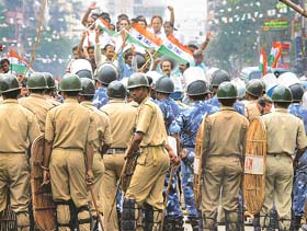 Policemen block a street as supporters of the Trinamool Congress protest during the hearing of the Delimitation Commission in Kolkata
