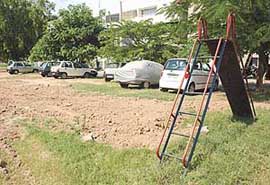 Cars parked in a children park in Sector 47, Chandigarh.