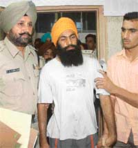 Accused in the Sector 17 bus terminus blast case Charanjit Singh at the city Police Headquarters in Chandigarh on Friday. 