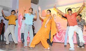 Students of Government College of Art dance during a freshers party on the college premises in Sector 10
