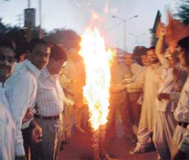 BJP workers burn an effigy of the Petroleum Minister, Mr Mani Shankar Aiyar, to protest against the hike in the prices of petrol and diesel