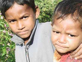 These children work at an orchard but get no apples to eat.