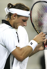 David Nalbandian of Argentina gestures after a missed point against Roger Federer 