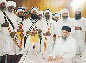 Baba Sadhu Singh with Panj Pyaras at the baptisation ceremony held at the Sector 28 Nanaksar in Chandigarh on Saturday.