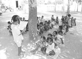 A typical class of a Punjab school in progress  right under a tree