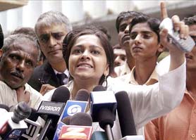 Priti Jain is seen addressing the media