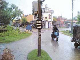 High-tension electricity wires hang loosely from a pole at Model Town in Pathankot
