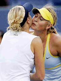 Maria Sharapova of Russia kisses Kim Clijsters of Belgium after their semi-final match