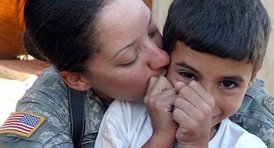 A US soldier hugs an Iraqi boy at a refugee camp near the northern town of Tal Afar on Friday. Iraqi and US forces have launched an attack on Tal Afar to rid it of suspected terrrorists, Iraqs Prime Minister Ibrahim Jaafari said on Saturday