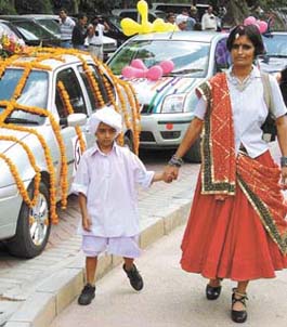 A mother with her child in a traditional Haryanvi dress at Ford Fun Family Car Rally at Tivoli Garden in Capital