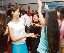 (Top) Students of DD Jain College of Education show their hands with mehendi on the occasion of a talent-hunt competition in Ludhiana on Saturday; (below) students of the Sportking Institute of Fashion Technology at a freshers day function held in Ludhiana on Saturday. 