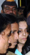 Model Preeti Jain is produced at the holiday court in Mumbai on Sunday for allegedly conspiring to murder film maker Madhur Bhandarkar
