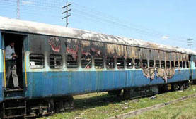 A coach of the Jammu-Tawi Ferozepore Express which caught fire at the Ferozepore cantonment railway station on Sunday.