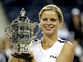 Kim Clijsters of Belgium poses with the trophy after winning the womens singles title at the US Open in New York on Saturday