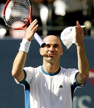 Andre Agassi of the US celebrates his victory compatriot Robby Ginepri