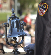 A member of the Fire Department of New York rings a ceremonial bell during the first moment of silence at the fourth anniversary of the attacks on the World Trade Center in New York on Sunday.
