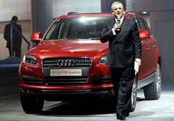 Audi CEO Martin Winterkorn poses next to a new Audi Q7 car at the International Car Show (IAA) in Frankfurt on Monday. 