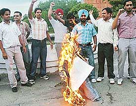 ABVP activists burn an effigy of the Punjabi University authorities for their alleged dictatorial and undemocratic attitude against the Law Department students of the university outside the VCs Office at Panjab University, Chandigarh, on Monday