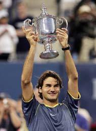 Roger Federer of Switzerland holds the US Open mens singles trophy at Flushing Meadows in New York on Sunday