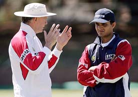Indias cricket coach Greg Chappell talks to captain Sourav Ganguly during a practice session at the Queens Sports Club in Bulawayo on Monday