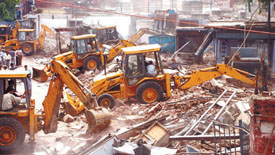 MCD bulldozers demolishing illegal constructions in the Jama Masjid area in the Capital on Tuesday