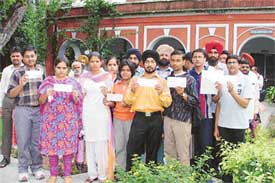 Students show admission slips issued by the BFUHS, in Ludhiana on Tuesday