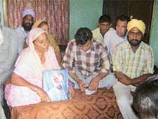 Hardip Singh, along with his mother, after knowing about his fathers death at Seelon Kalan village in Ludhiana on Tuesday