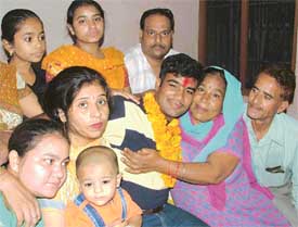 Bharat Bhushan being hugged by his mother after reaching home in Ludhiana on Tuesday