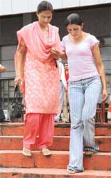 Rajwinder Kaur being helped after the felicitation function at Phillaur