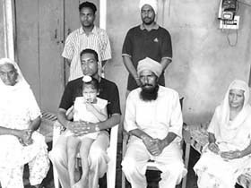 Kulwinder Singh with his family members at Timberpur village in Fatehgarh Sahib