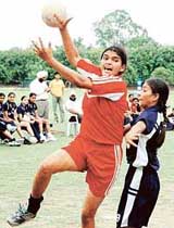 Maninder Kaur of the GTB Khalsa College for Women, Dasuya, attempts a shot in a match against GCW, Ludhiana, during the inter-college handball tournament on Wednesday