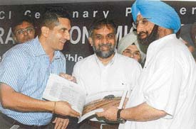Chief Minister Amarinder Singh releases Song of the Seasons, a pictorial representation of 12 months by photographer T.P.S. Sandhu at a function in Ludhiana