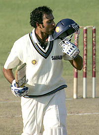 India's batsman VVS Laxman, kisses his helmet after completing his century on the second day of the first Test against Zimbabwe in Bulawayo on Wednesday